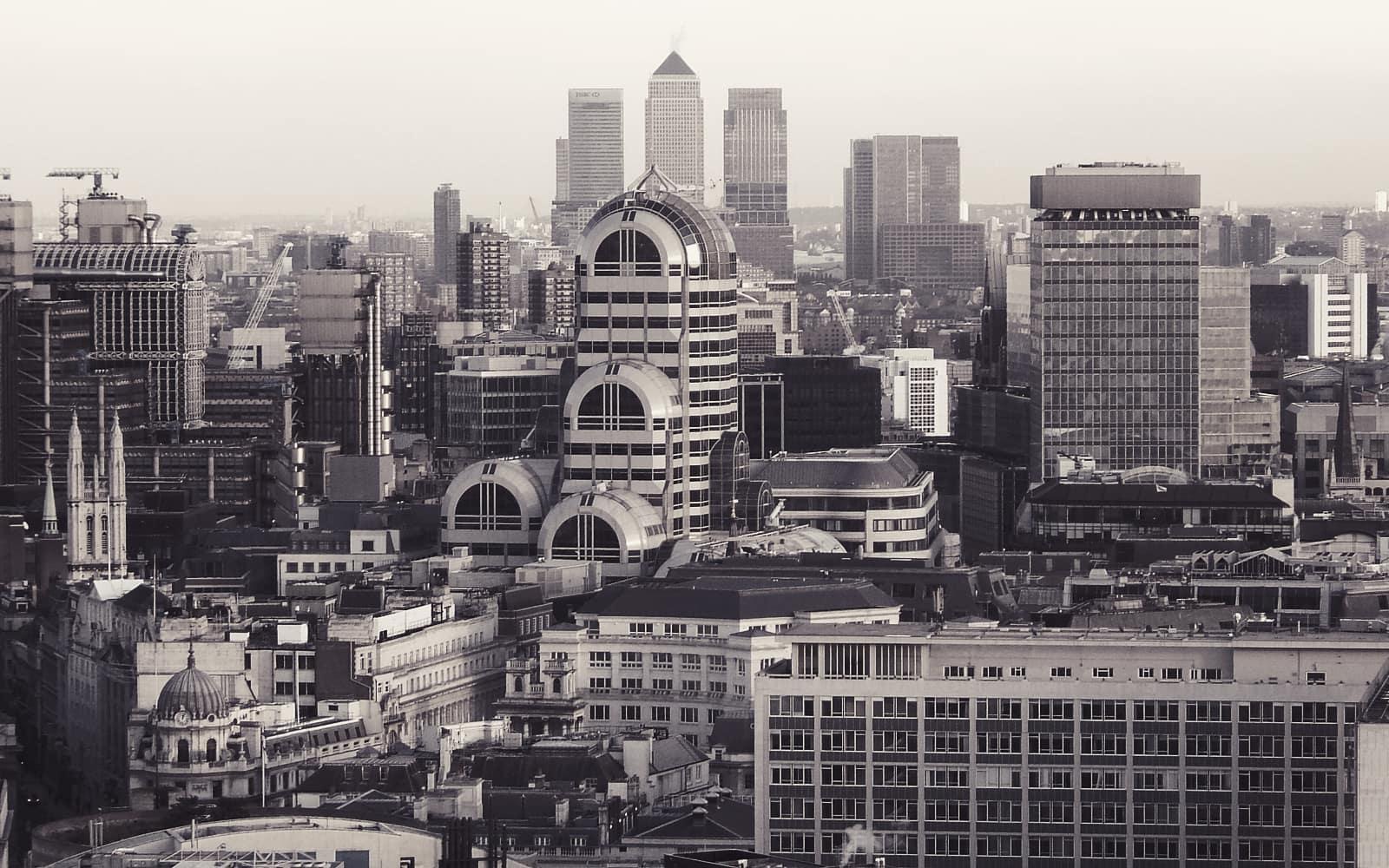 The Canary Wharf skyline seen across London rooftops