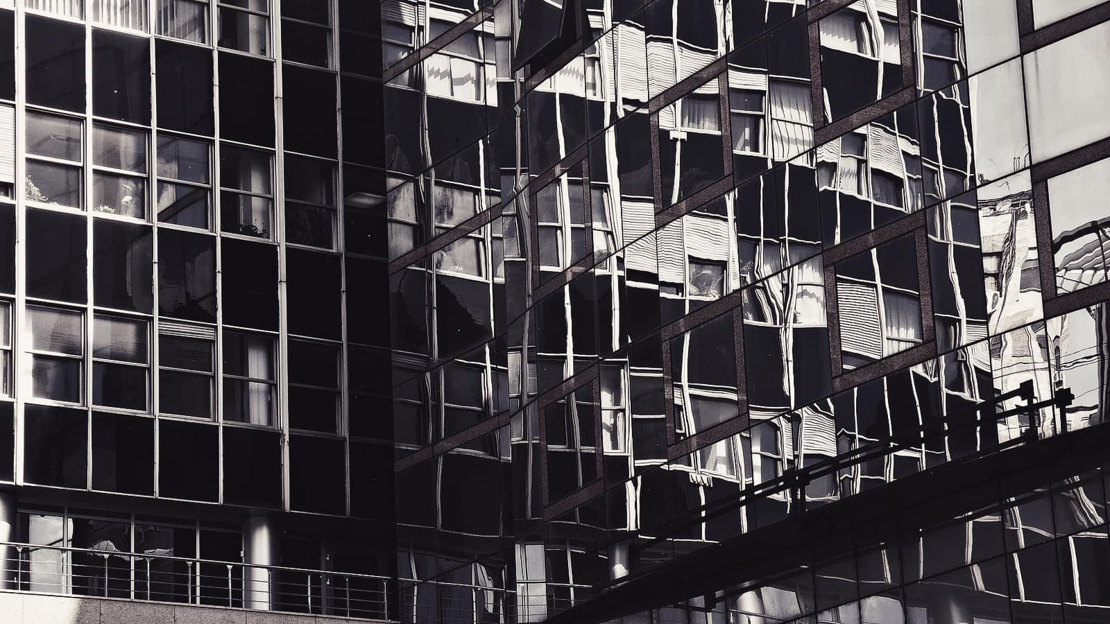 Close view of a modern office building's glass facade
