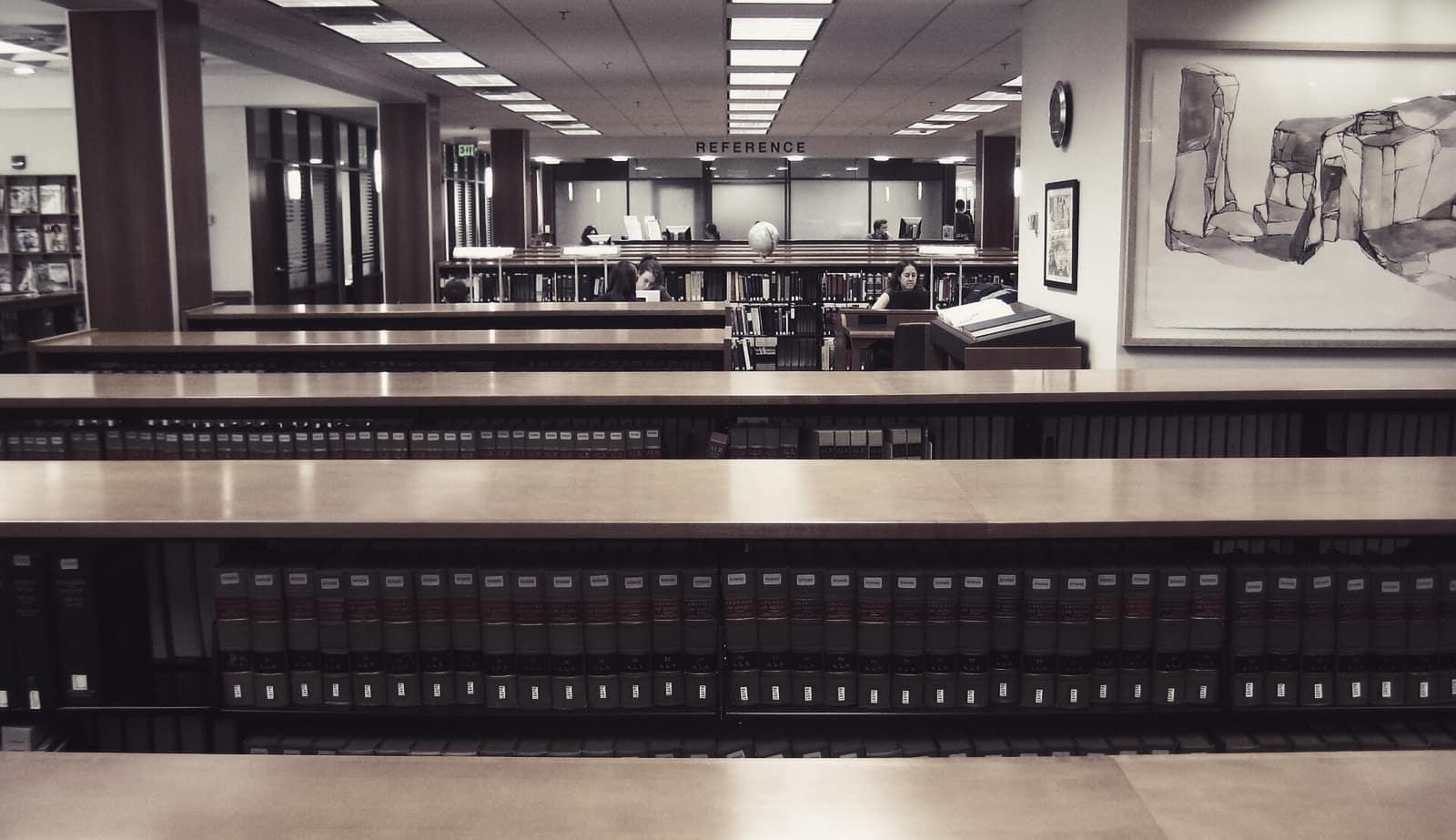 Rows of bound law reports on library shelves