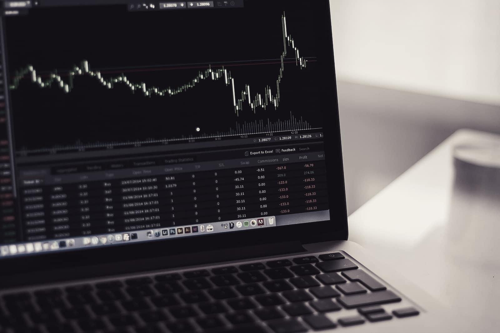 Price chart and market data on a laptop screen